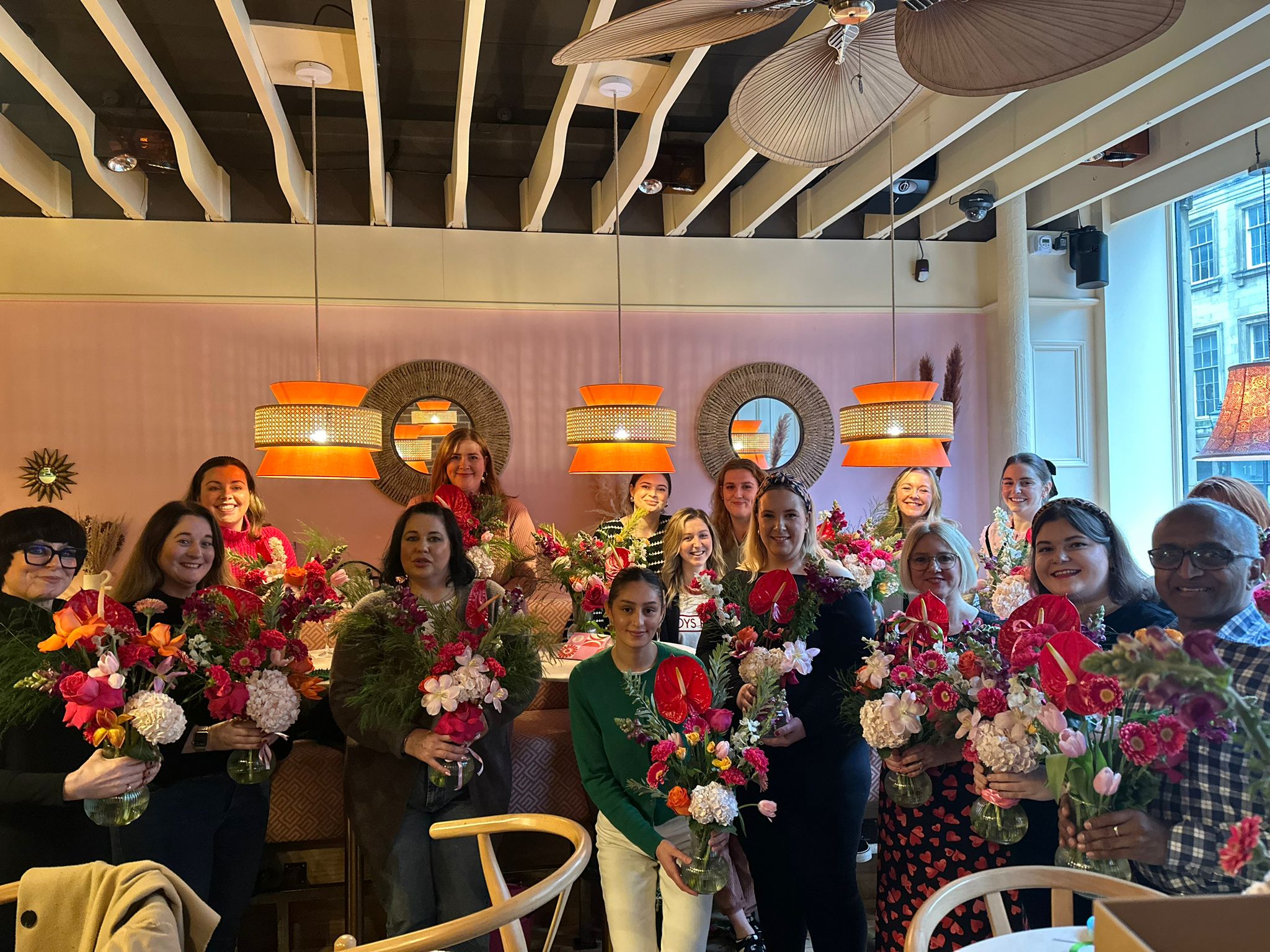 Group photo with their floral arrangements at a recent Sunday Girl vase arrangement workshop at Cafe Mercy