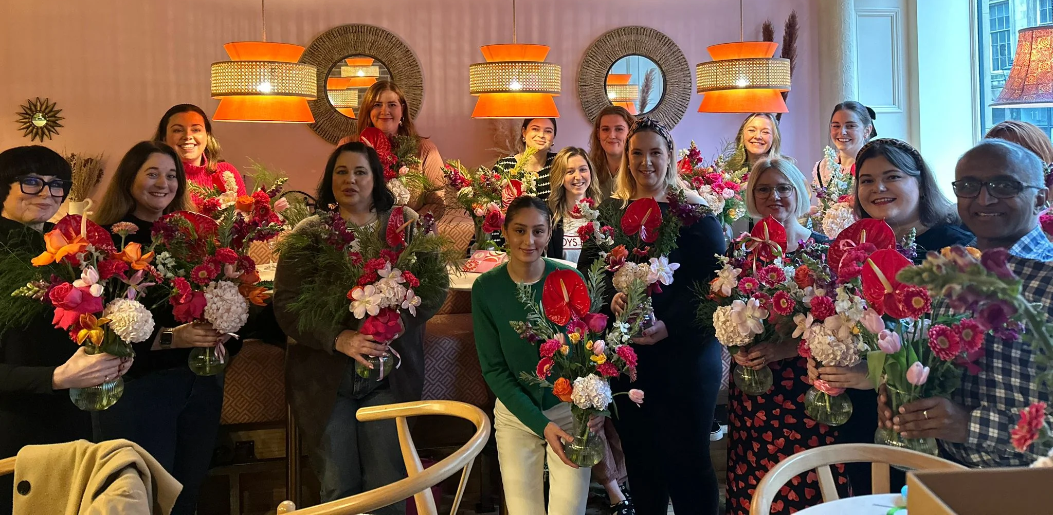 Group photo with their floral arrangements at a recent Sunday Girl vase arrangement workshop at Cafe Mercy